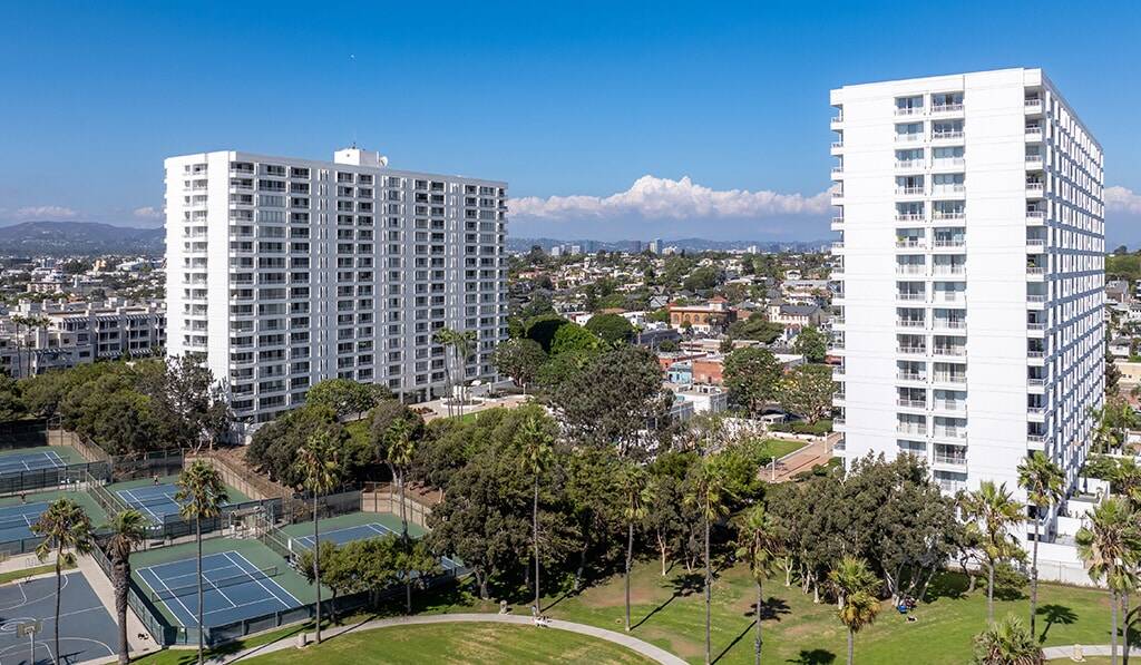 Exterior of The Shores shows tennis courts