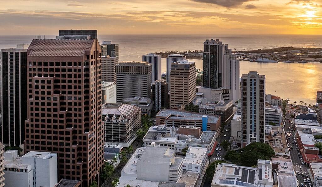 Aerial view of The Residences at Bishop Place at sunset with harbor in background