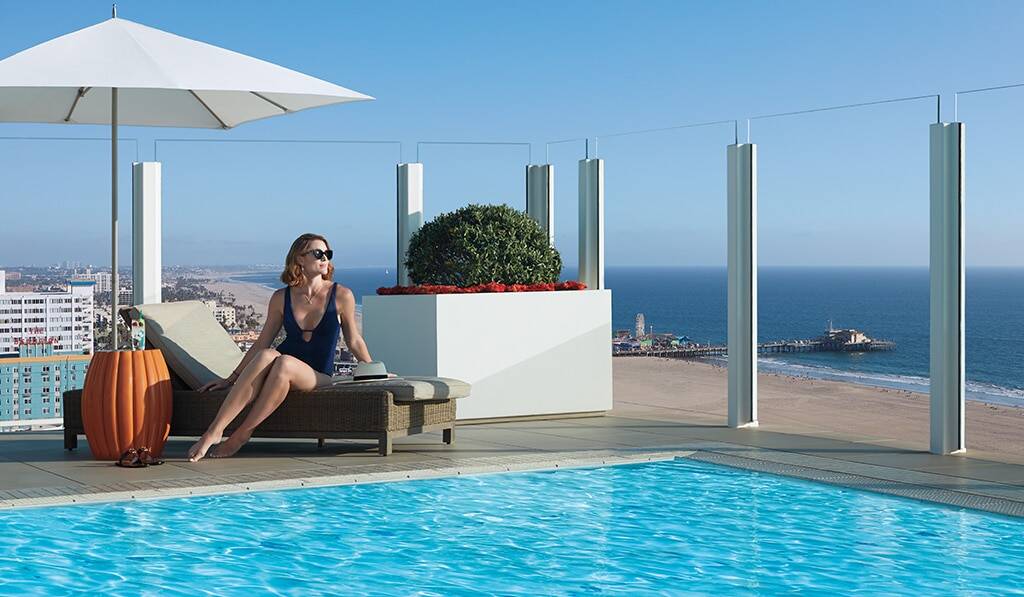 Rooftop Pool with woman in bathing suit