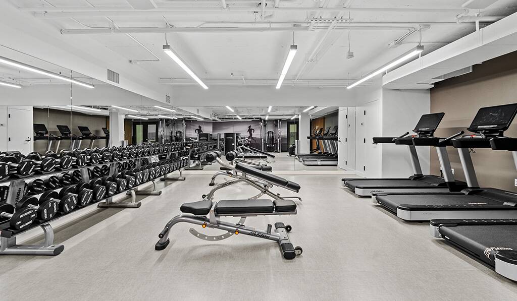 555 Barrington apartment fitness center witth free weights and treadmills