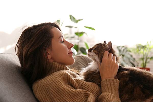 Womam on sofa with cat