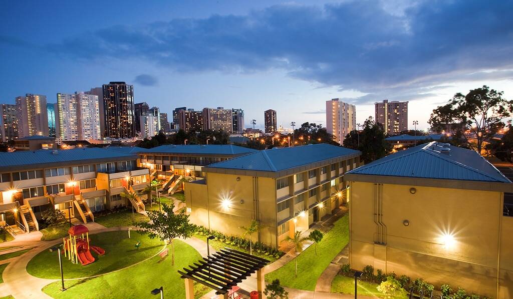 Exterior of Waena at dusk- shows Downtown Honolulu in background