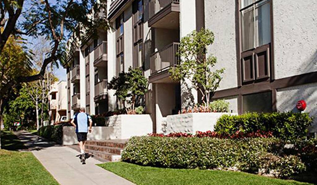 Barrington Kiowa exterior with man jogging by
