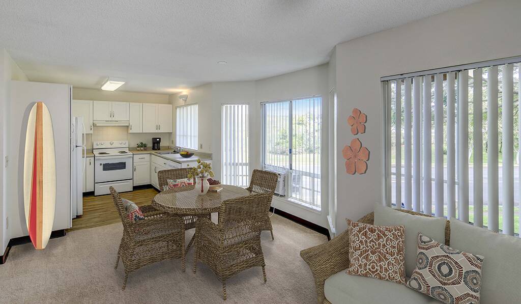 Furnished ground floor apartment shows kitchen and living room