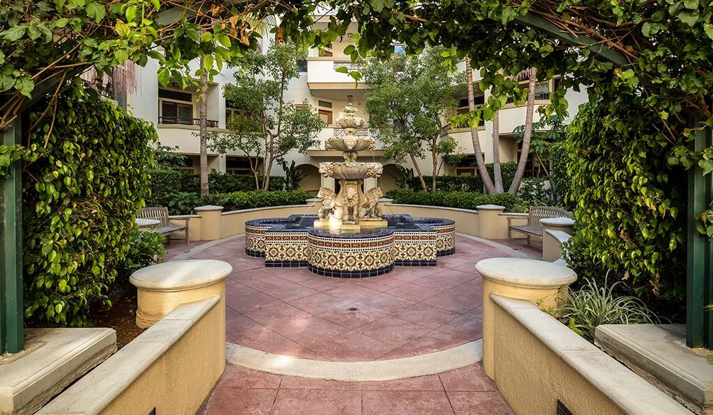 Landscaped Courtyard with Mediterranean tiled fountain