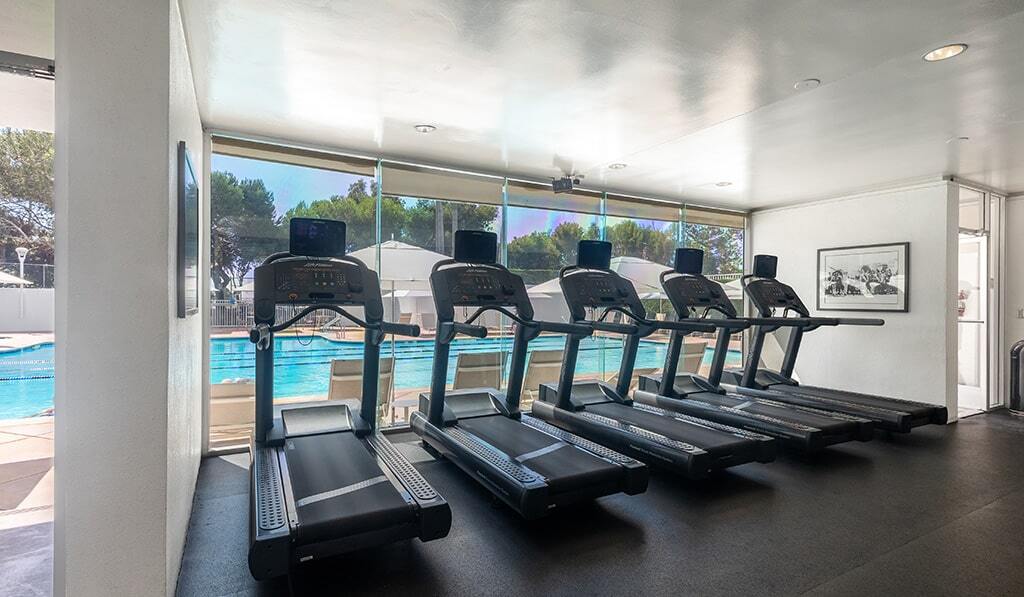 Gym at The Shores overlooks the pool