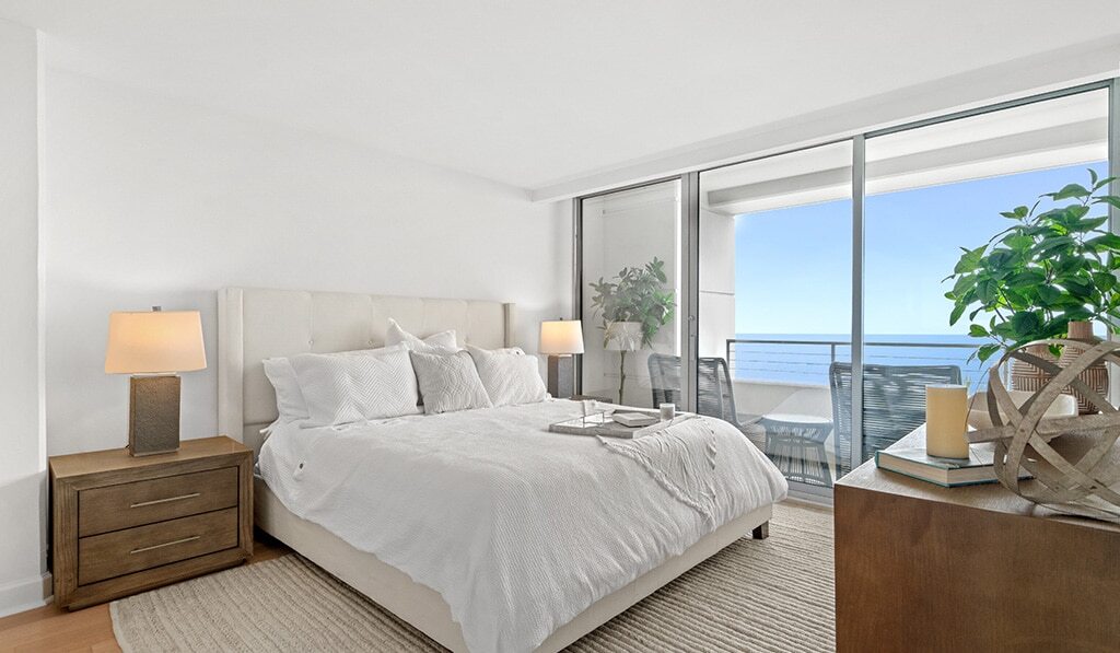 Furnished bedroom with ocean view