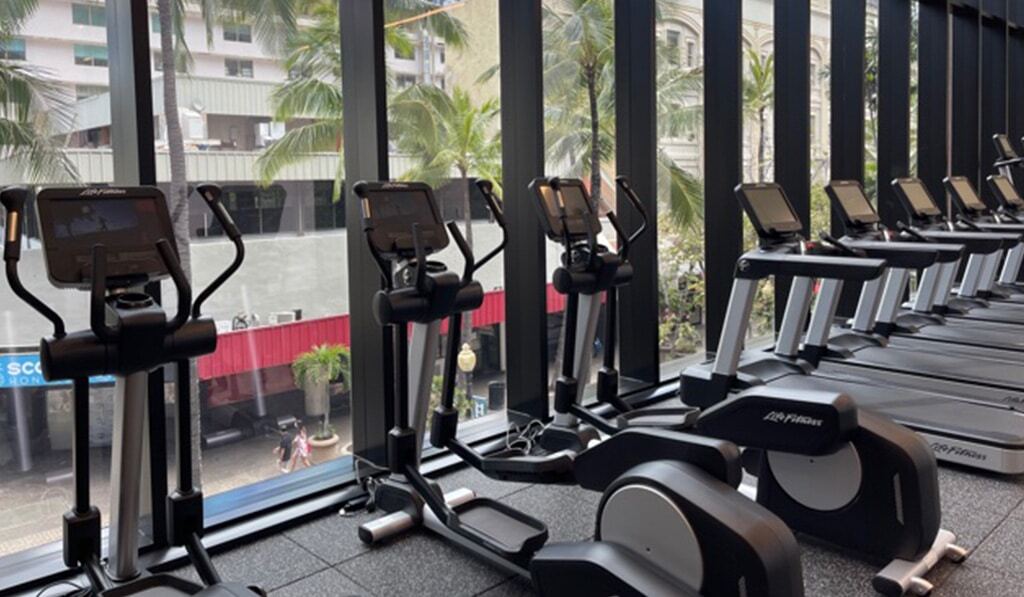 row of stationary bikes and treadmills