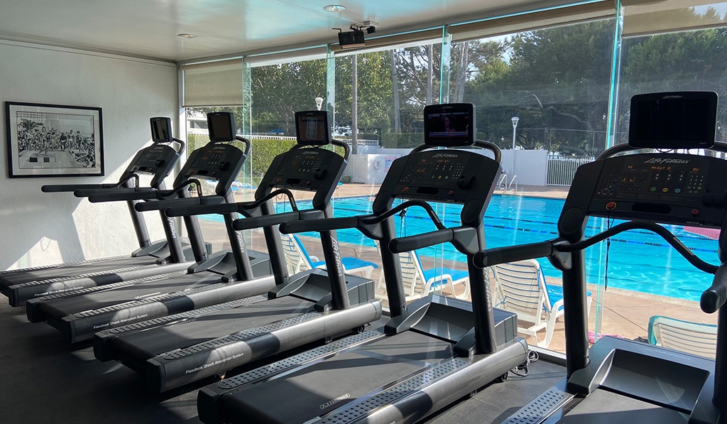 Treadmills in front of pool at Santa Monica apartment