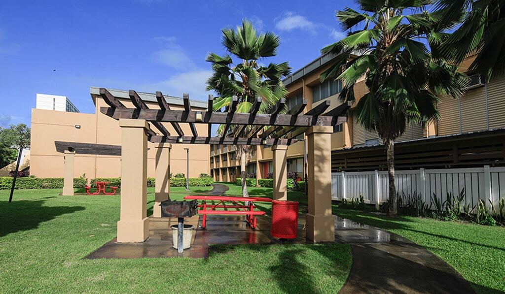 Exterior Shot at Waena shows picnic table and bbq